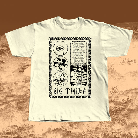 Beige T-shirt with black vintage-style print featuring an eye, flower, skeleton ribcage, and a poetic text block framed by a decorative border with “BIG THIEF” written at the bottom.