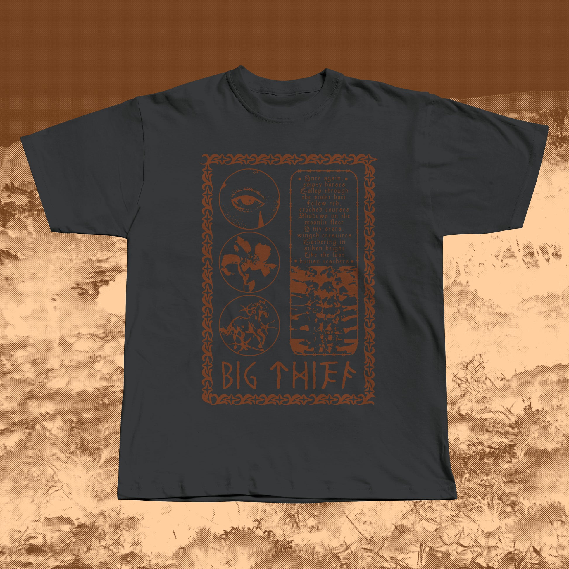 Black T-shirt with earthy brown vintage-style print featuring an eye, flower, skeleton ribcage, and a poetic text block framed by a decorative border with “BIG THIEF” written at the bottom.