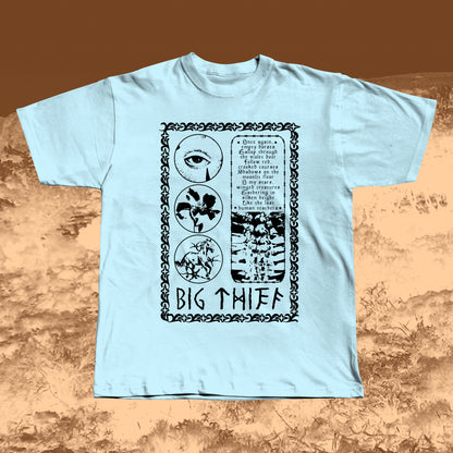 Light Blue T-shirt with black vintage-style print featuring an eye, flower, skeleton ribcage, and a poetic text block framed by a decorative border with “BIG THIEF” written at the bottom.