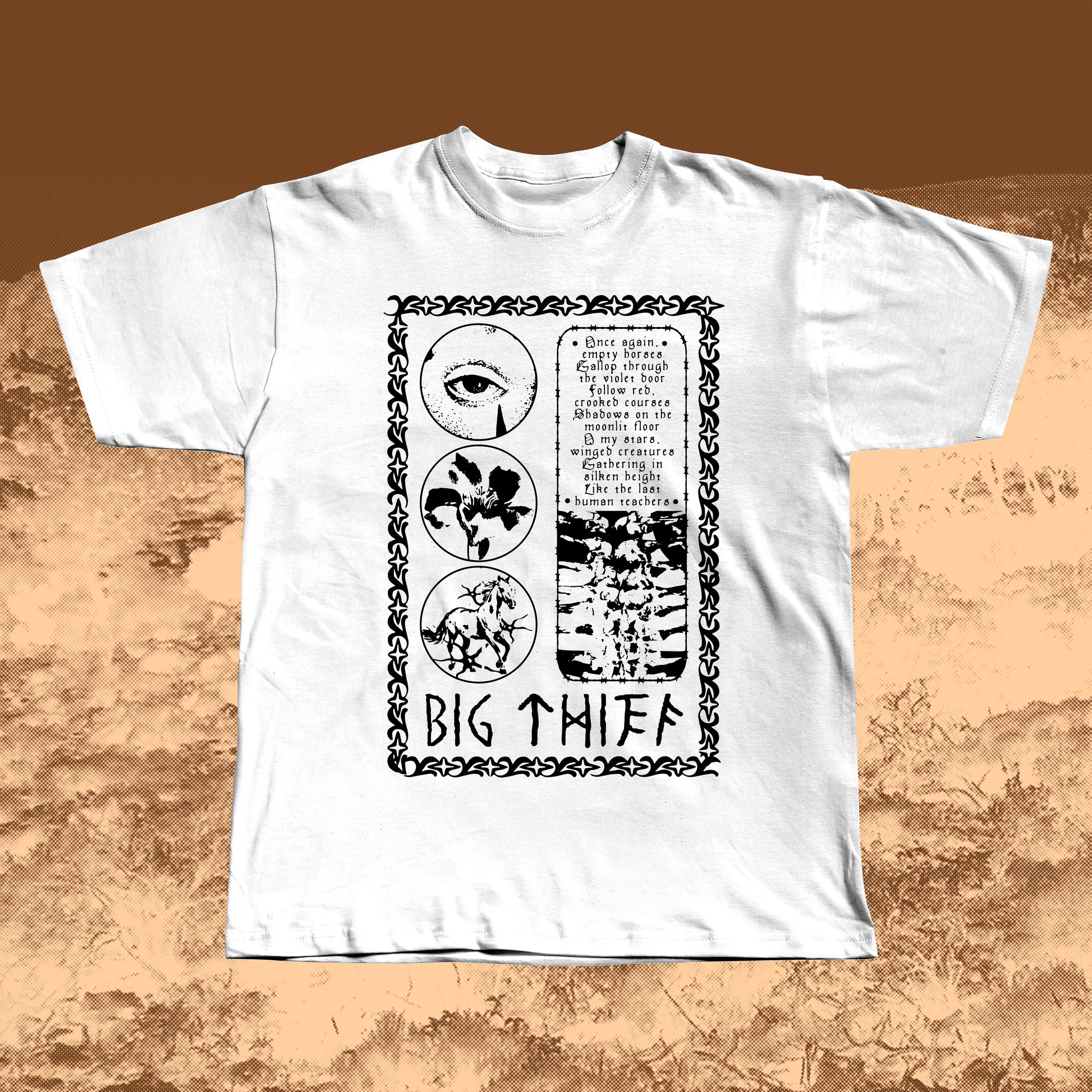 White T-shirt with black vintage-style print featuring an eye, flower, skeleton ribcage, and a poetic text block framed by a decorative border with “BIG THIEF” written at the bottom.