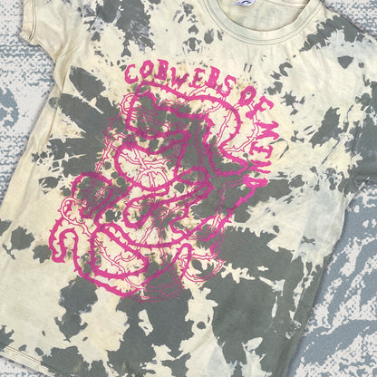 T-shirt with pink graphic design and text on a textured surface