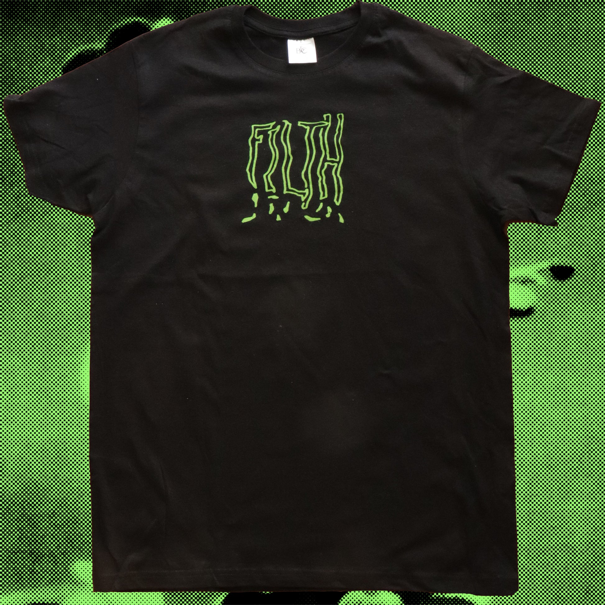Front view of black t-shirt, FILTH is written with bold writing in neon green.