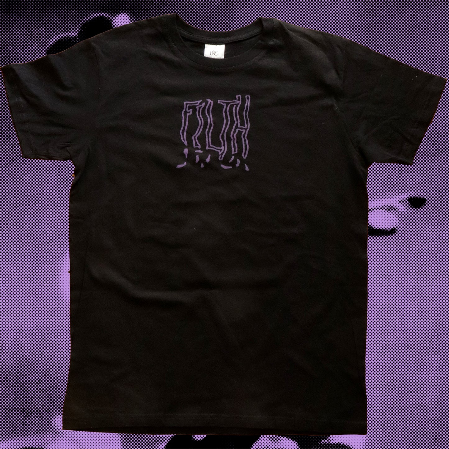 Black t-shirt featuring a purple hand screen-printed design that writes FILTH with bold lettering in front.