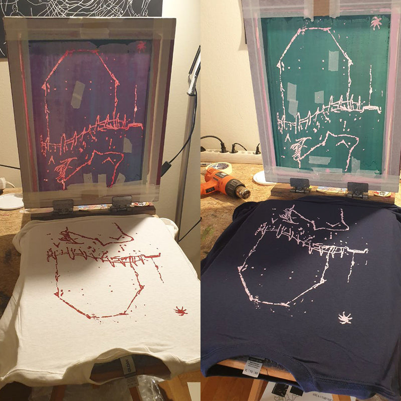Screen printing process on a white t-shirt and a blue t-shirt with a design.