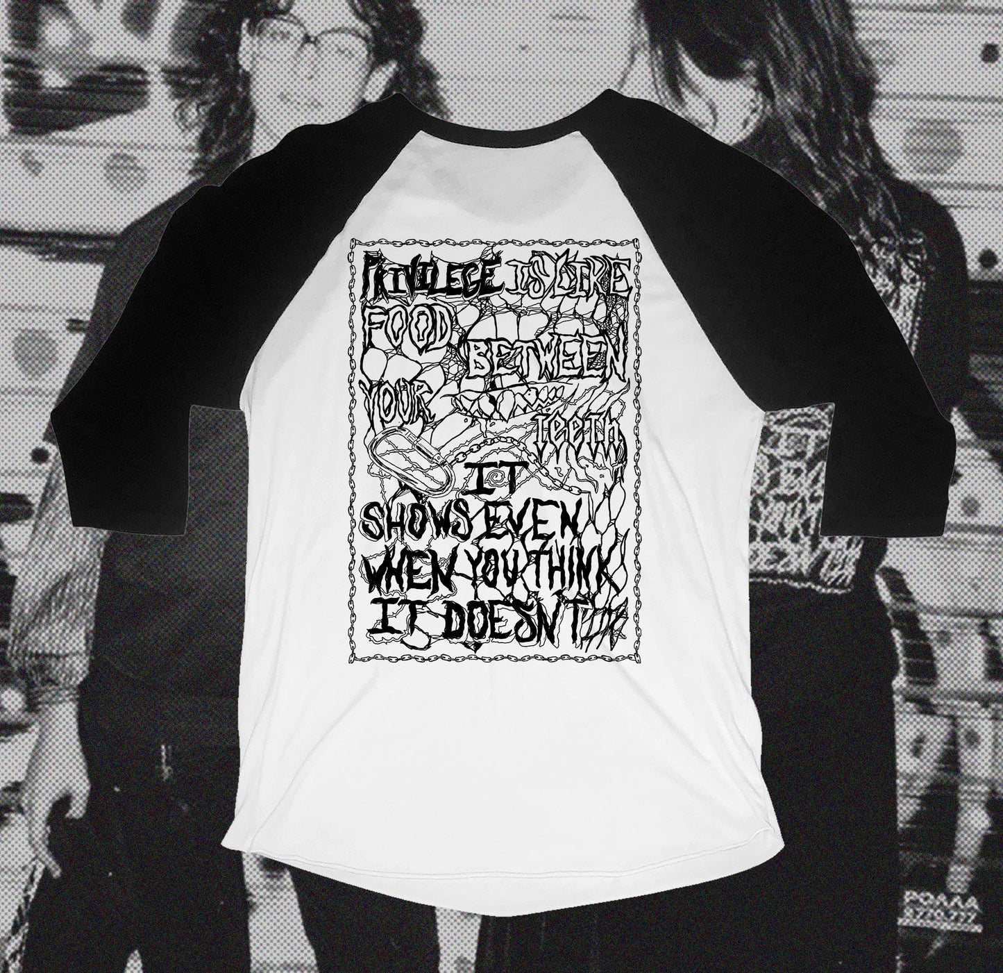 Back of white and black baseball shirt with chain design that writes Privilege is like food between your teeth it shows even when you think it doesn't, hand screen printed with Bipolia logo on the collar.