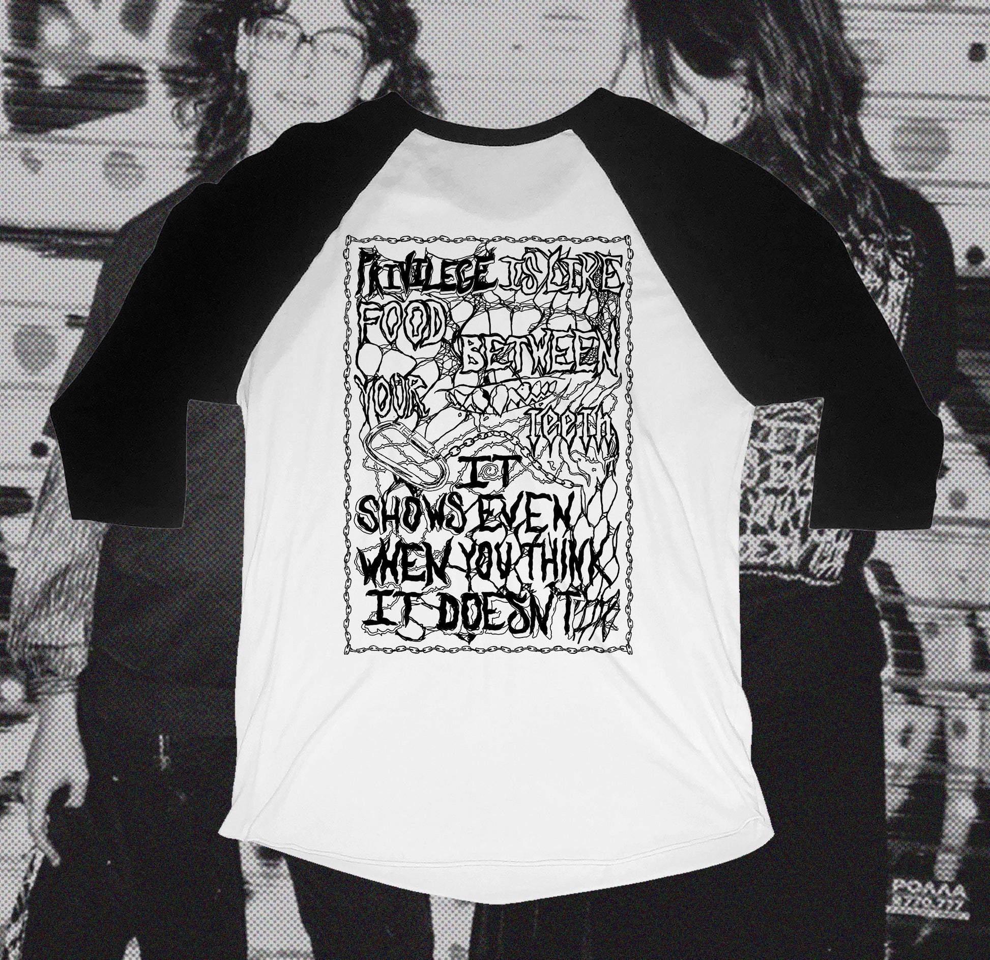 Back of white and black baseball shirt with chain design that writes Privilege is like food between your teeth it shows even when you think it doesn't, hand screen printed with Bipolia logo on the collar.