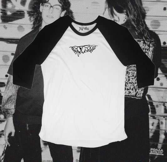 White and black baseball shirt with teeth design in front, hand screen printed with Bipolia logo on the collar.