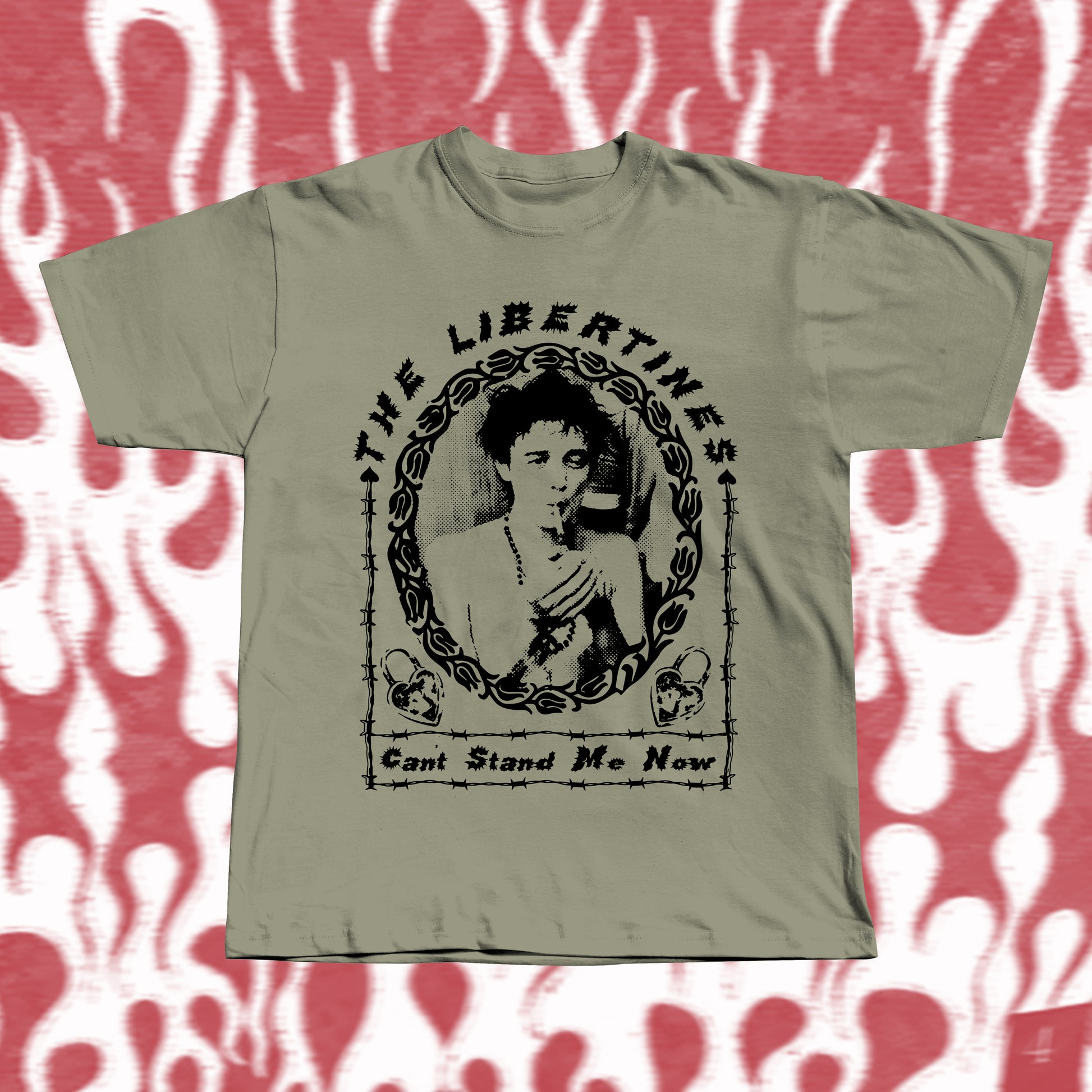 Handmade khaki t-shirt with bold black screen-printed fan art inspired by The Libertines. Features a vintage-style portrait framed in barbed-wire pattern, with the band name “The Libertines” above and the song title “Can’t Stand Me Now” below.