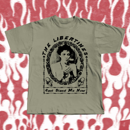 Handmade khaki t-shirt with bold black screen-printed fan art inspired by The Libertines. Features a vintage-style portrait framed in barbed-wire pattern, with the band name “The Libertines” above and the song title “Can’t Stand Me Now” below.