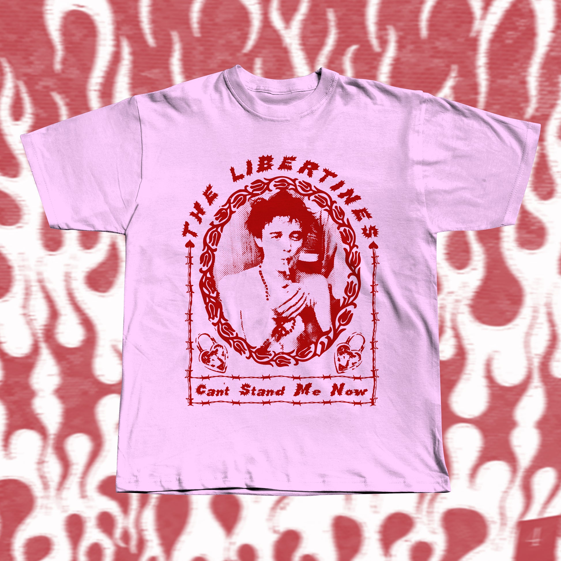 Handmade pink t-shirt with bold red screen-printed fan art inspired by The Libertines. Features a vintage-style portrait framed in barbed-wire pattern, with the band name “The Libertines” above and the song title “Can’t Stand Me Now” below.