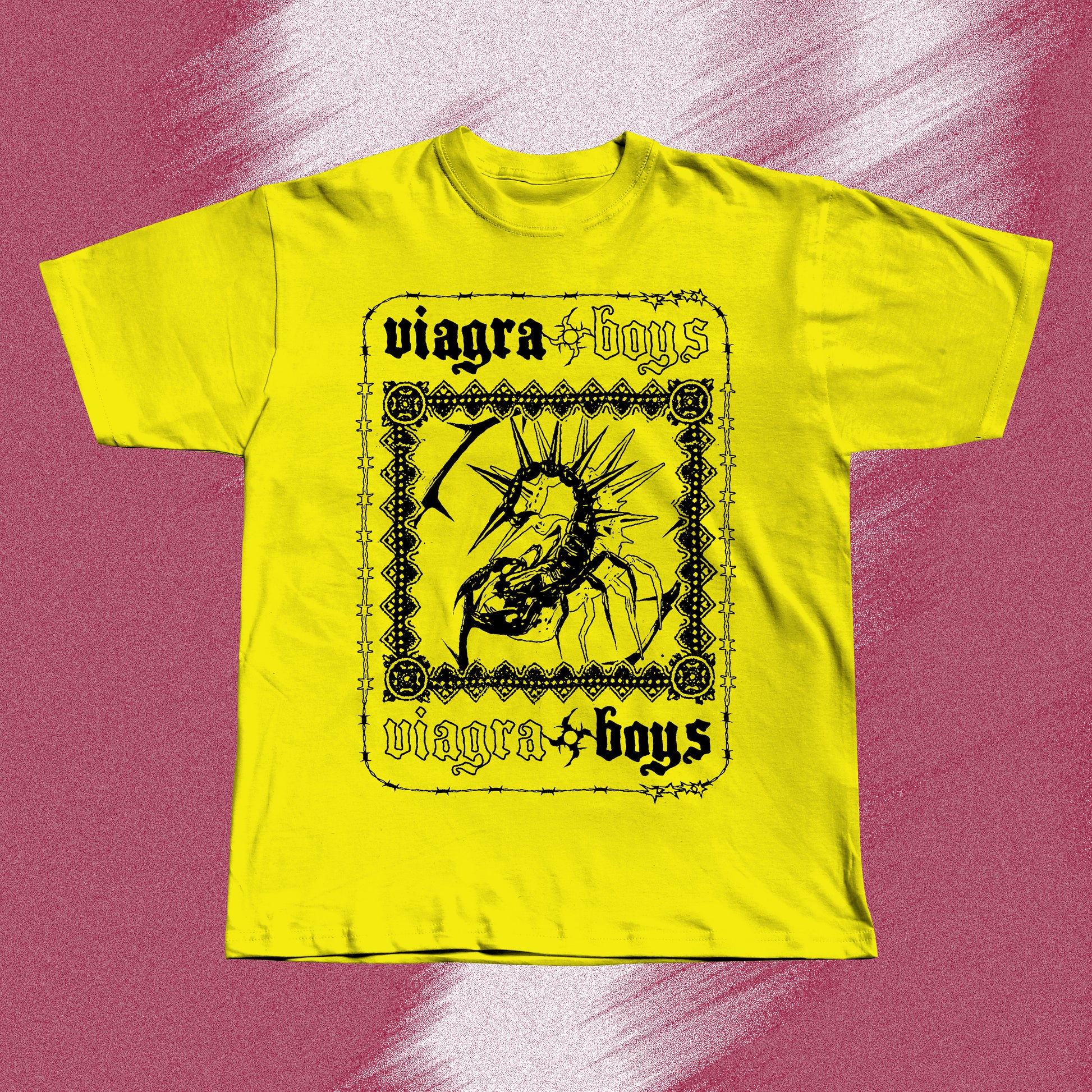 Yellow hand screen printed t-shirt with a black graphic print of a spider with spikes on its back. The spider is inside a black frame with the words 'viagra boys' written above and below the spider.