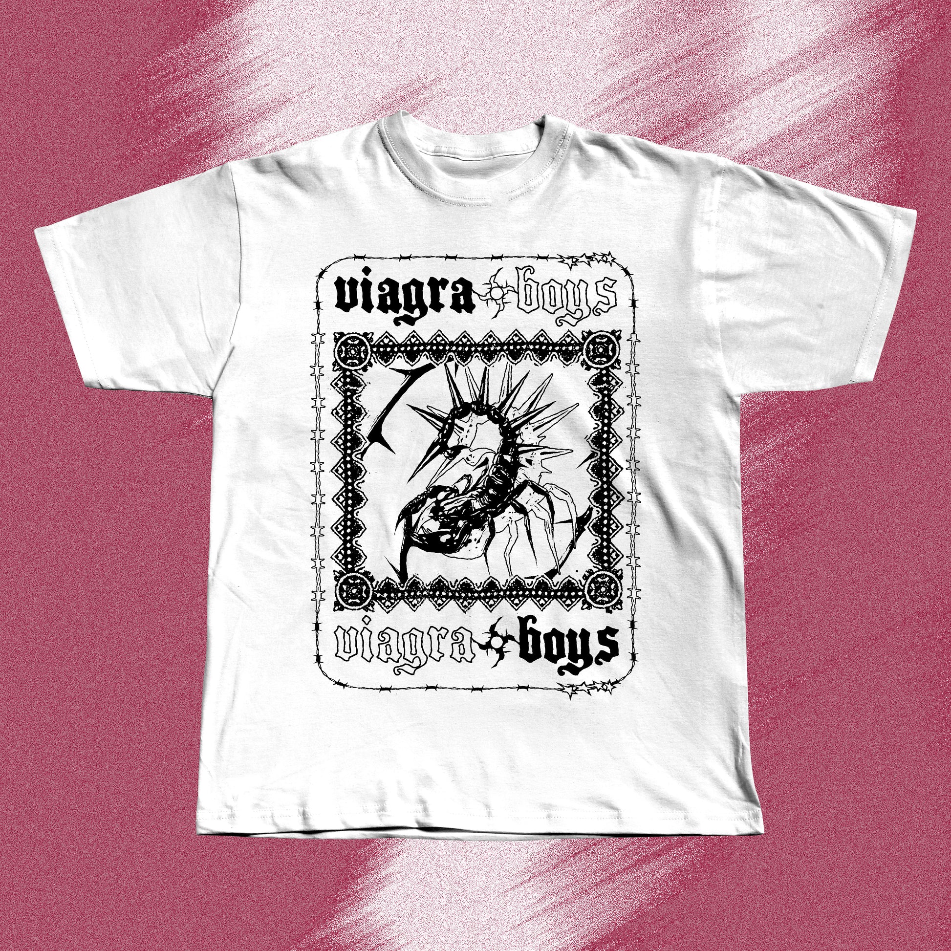White hand screen printed t-shirt with a black graphic print of a spider with spikes on its back. The spider is inside a black frame with the words 'viagra boys' written above and below the spider.